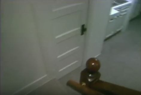 bottom-of-basement-stairs-and-door-to-bathroom